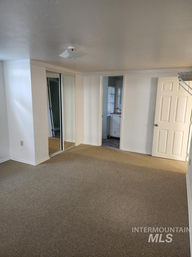 855 N 9th E, Mountain Home, ID 83647 - carpeted empty room with baseboards