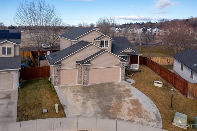 view of front of property featuring a garage, cooling unit, and a front lawn