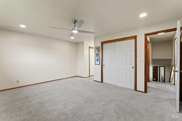 unfurnished bedroom with baseboards, recessed lighting, and carpet