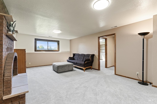 living room featuring a fireplace, visible vents, carpet floors, and a textured ceiling