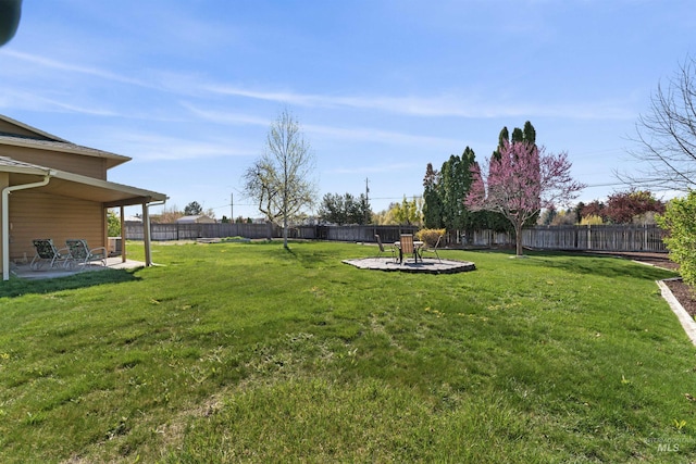 view of yard featuring a fenced backyard and a patio