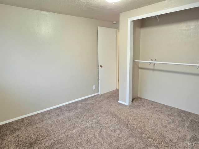 701 Union Ave, Filer, ID 83328 - unfurnished bedroom with carpet, a closet, and a textured ceiling