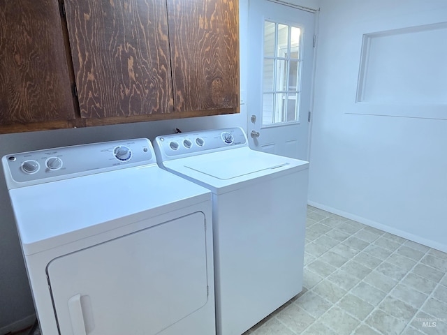 701 Union Ave, Filer, ID 83328 - laundry area featuring baseboards, washing machine and dryer, and cabinet space