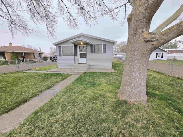 701 Union Ave, Filer, ID 83328 - bungalow-style house with a front yard, fence, and entry steps