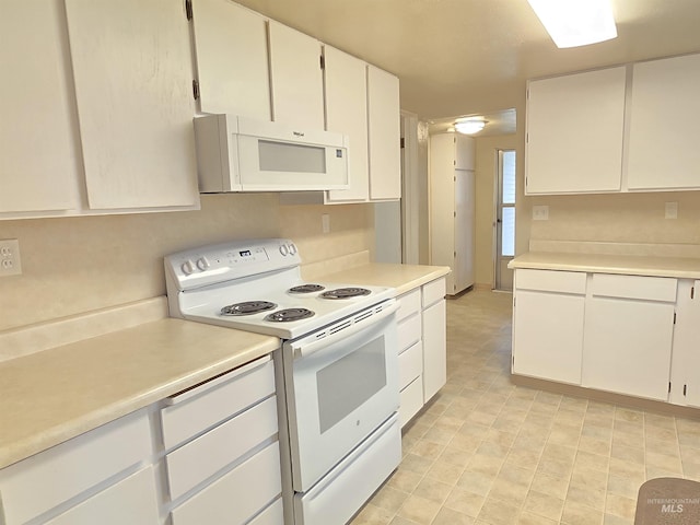 701 Union Ave, Filer, ID 83328 - kitchen featuring white cabinets, light countertops, and white appliances