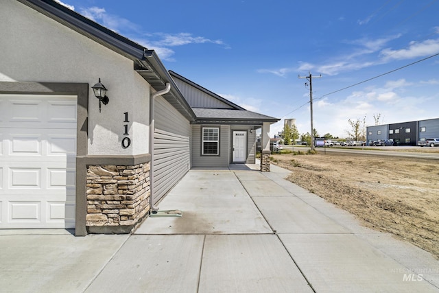 property entrance featuring a garage