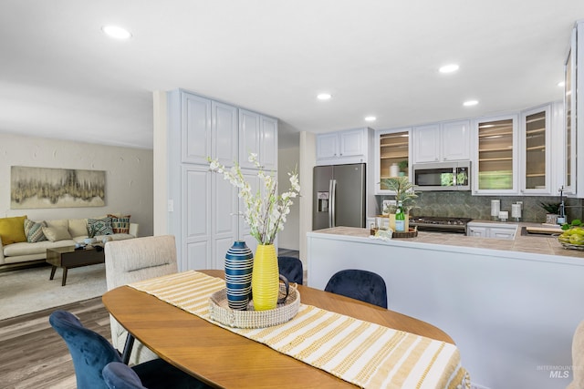 4130 S Ticonderoga Way, Boise, ID 83706 - dining space with light wood finished floors and recessed lighting