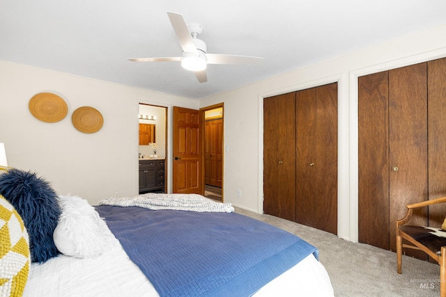 4130 S Ticonderoga Way, Boise, ID 83706 - carpeted bedroom featuring two closets, ceiling fan, and ensuite bathroom