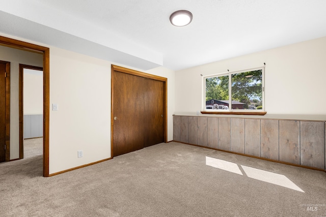 4130 S Ticonderoga Way, Boise, ID 83706 - unfurnished bedroom with carpet flooring, wainscoting, and a closet