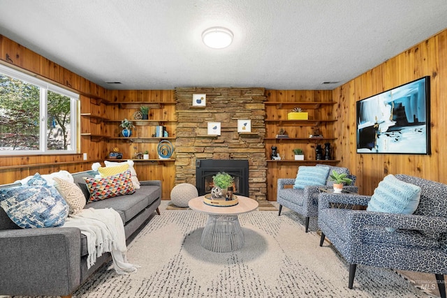 4130 S Ticonderoga Way, Boise, ID 83706 - living room with wooden walls, a textured ceiling, and a fireplace