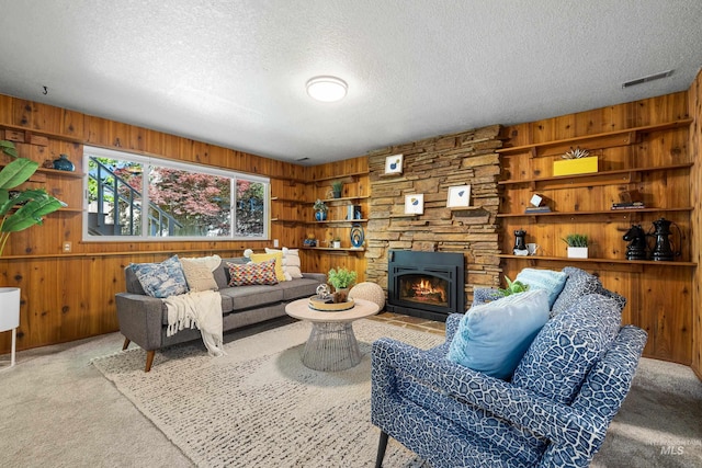 4130 S Ticonderoga Way, Boise, ID 83706 - carpeted living room with wood walls, a textured ceiling, and a fireplace