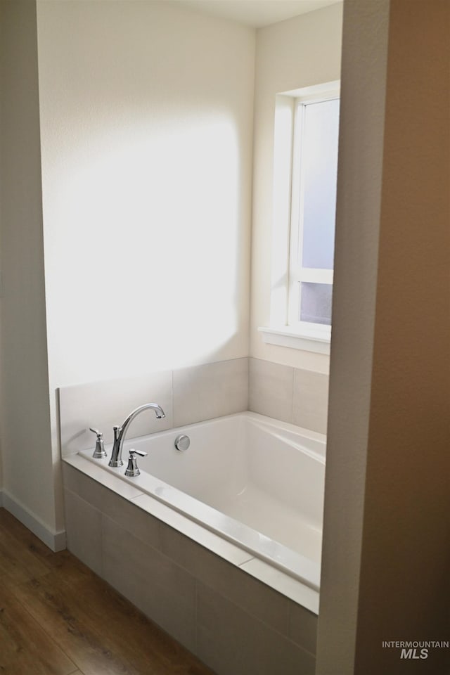 2188 Navigator St, Middleton, ID 83644 - full bathroom featuring wood finished floors and a bath
