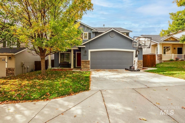 view of front of property with a garage and a front lawn