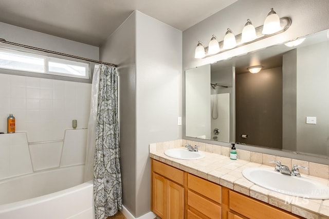 bathroom featuring vanity and shower / tub combo with curtain