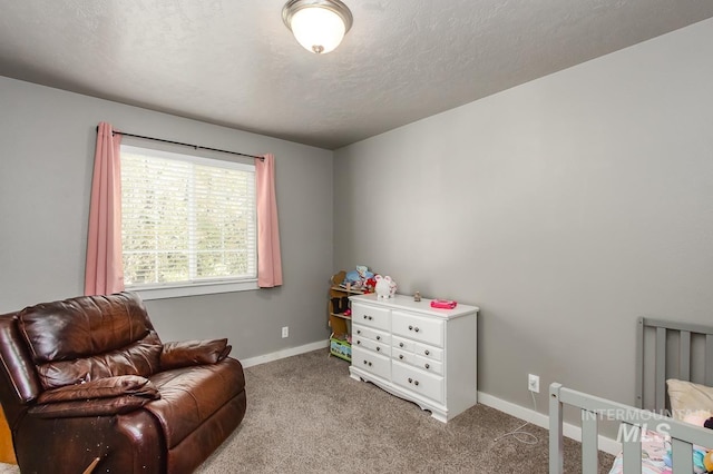 carpeted bedroom featuring a textured ceiling