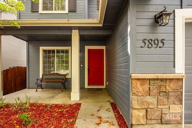 property entrance with covered porch