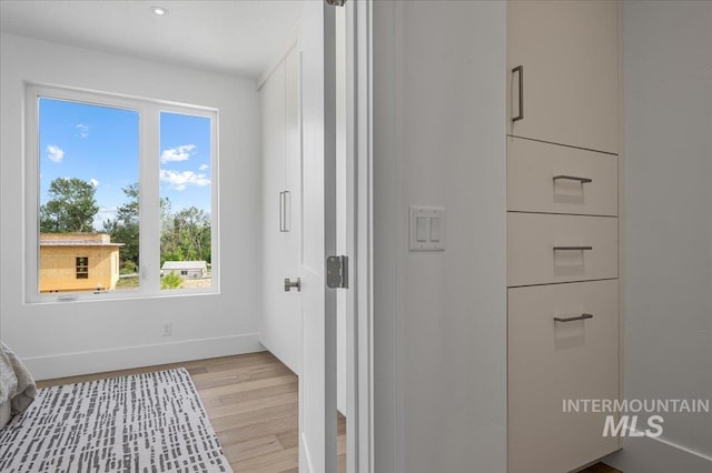 333 E Palapa Ln, Garden City, ID 83714 - hallway featuring baseboards and light wood-type flooring