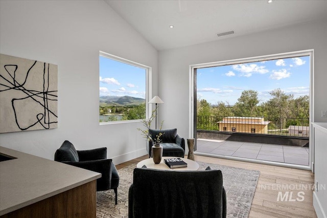 333 E Palapa Ln, Garden City, ID 83714 - sitting room featuring vaulted ceiling, wood finished floors, and recessed lighting