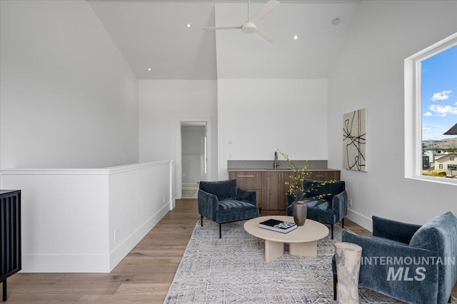 333 E Palapa Ln, Garden City, ID 83714 - sitting room featuring a ceiling fan, high vaulted ceiling, wood finished floors, and baseboards