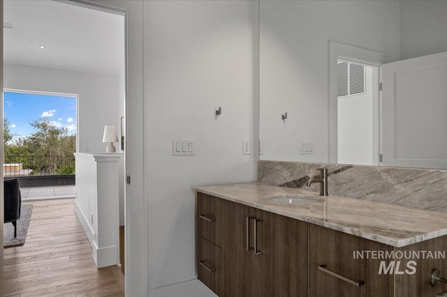 333 E Palapa Ln, Garden City, ID 83714 - bathroom with wood finished floors and vanity