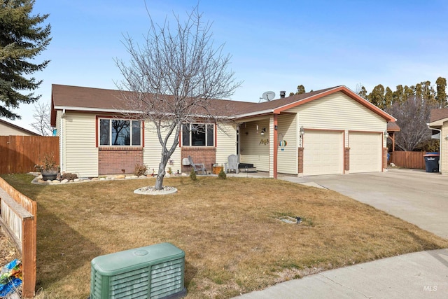 ranch-style house featuring brick siding, concrete driveway, fence, a garage, and a front lawn