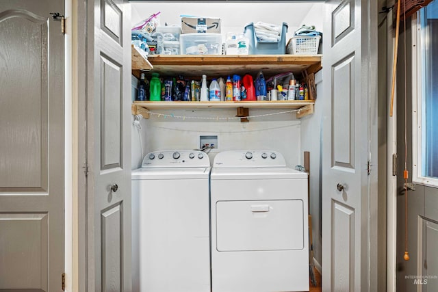 laundry area with laundry area and washer and clothes dryer