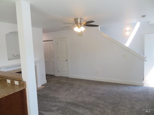 11026 W Garverdale Ln, Boise, ID 83713 - unfurnished living room featuring carpet flooring, ceiling fan, and baseboards