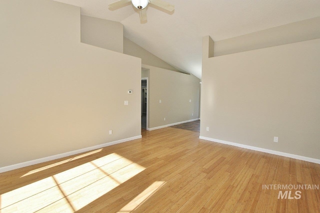 unfurnished room featuring light hardwood / wood-style floors, ceiling fan, and lofted ceiling