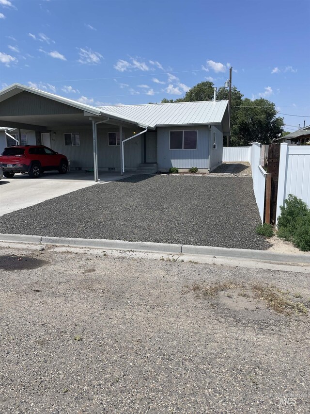 255 Elm, Vale, OR 97918 - ranch-style house with fence, metal roof, concrete driveway, and a carport
