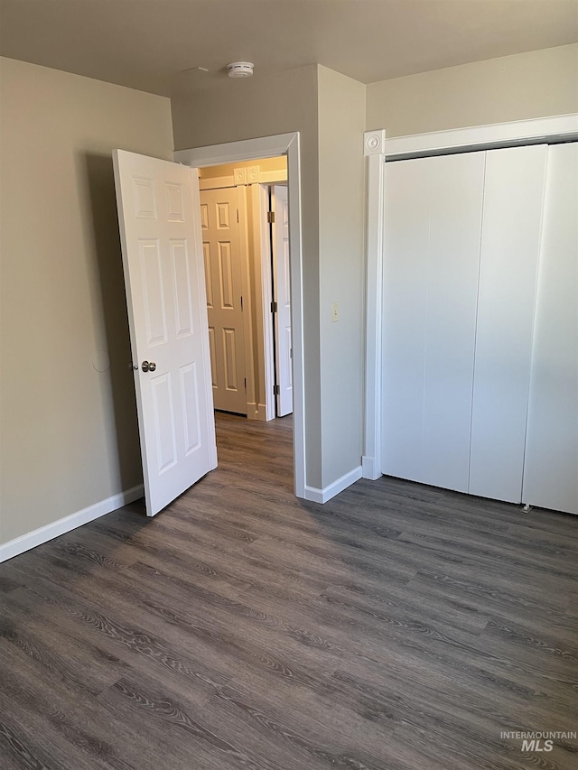 255 Elm, Vale, OR 97918 - unfurnished bedroom with baseboards, dark wood-type flooring, and a closet