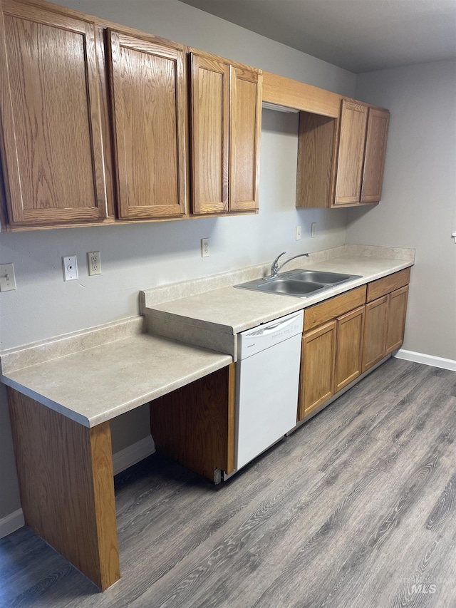 255 Elm, Vale, OR 97918 - kitchen with dishwasher, a sink, dark wood-style floors, light countertops, and baseboards