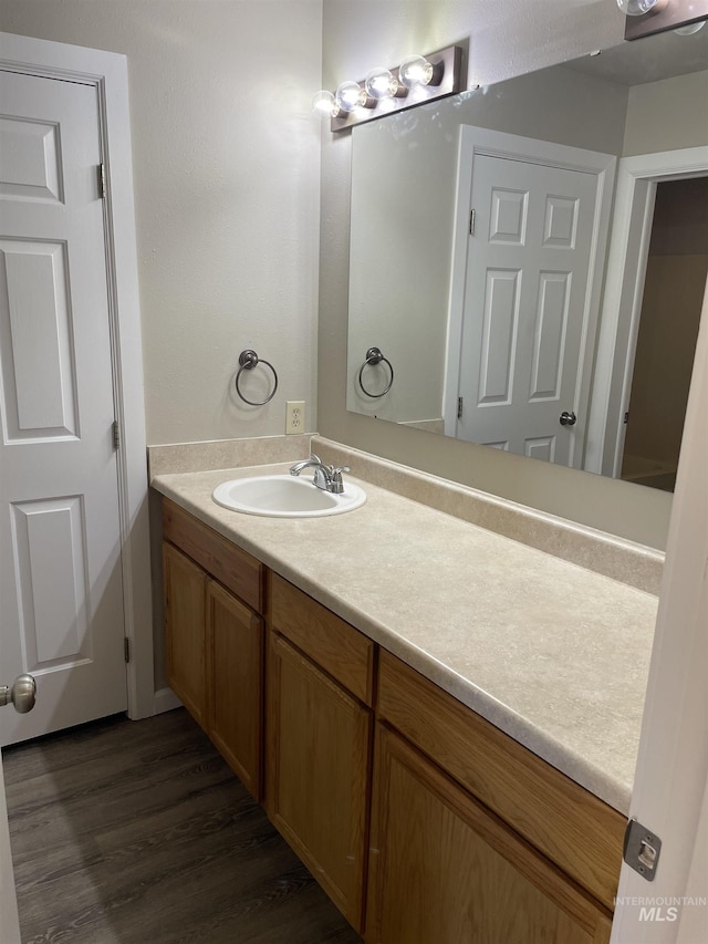255 Elm, Vale, OR 97918 - bathroom featuring wood finished floors and vanity