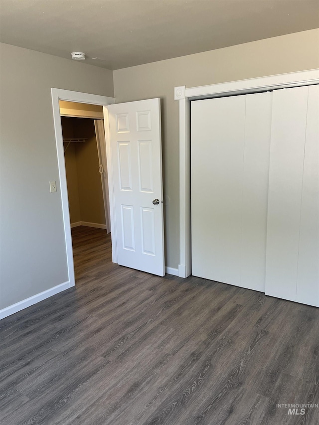 255 Elm, Vale, OR 97918 - unfurnished bedroom featuring a closet, dark wood-type flooring, and baseboards