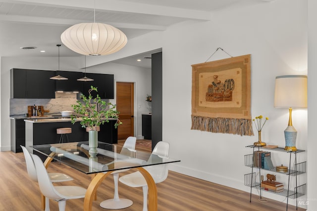 dining space with recessed lighting, visible vents, beamed ceiling, light wood-style floors, and baseboards