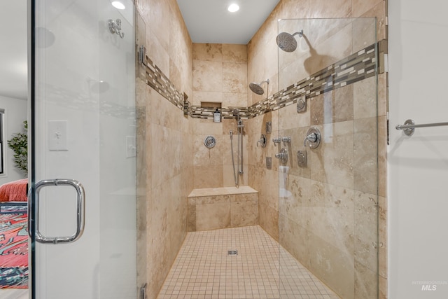bathroom with recessed lighting and a stall shower
