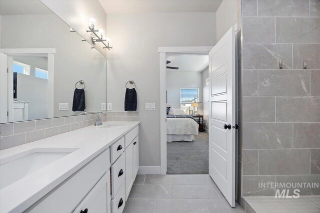 bathroom with ceiling fan and vanity