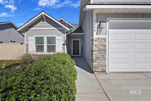 doorway to property featuring a garage