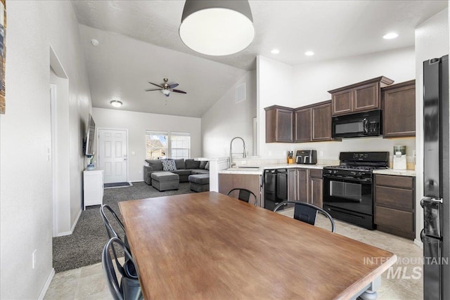 kitchen featuring sink, ceiling fan, high vaulted ceiling, dark brown cabinetry, and black appliances