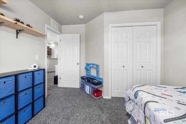 carpeted bedroom featuring a closet