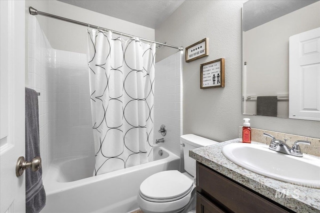 full bathroom featuring vanity, a textured ceiling, toilet, and shower / bath combo