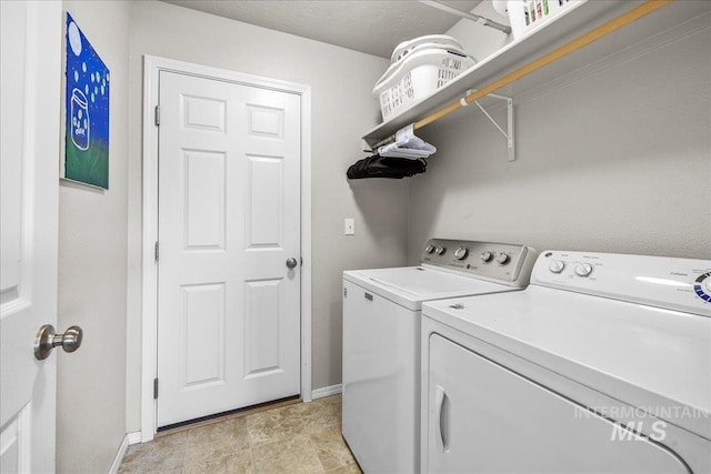 laundry room featuring separate washer and dryer