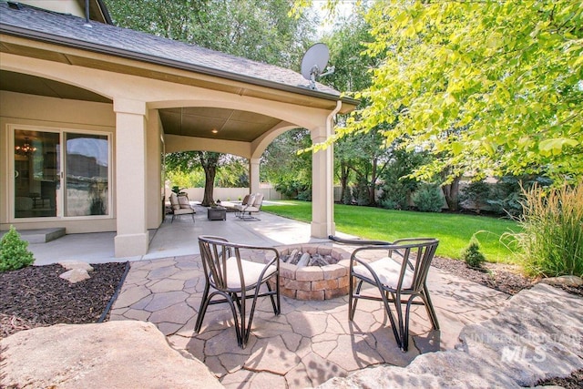 view of patio with an outdoor fire pit