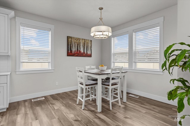 6413 E E Path, Nampa, ID 83687 - dining area with light wood-style flooring and baseboards