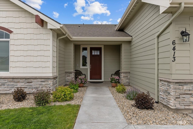6413 E E Path, Nampa, ID 83687 - view of exterior entry with stone siding and a shingled roof
