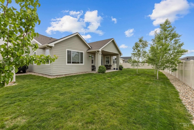 6413 E E Path, Nampa, ID 83687 - back of house with a patio area and roof with shingles