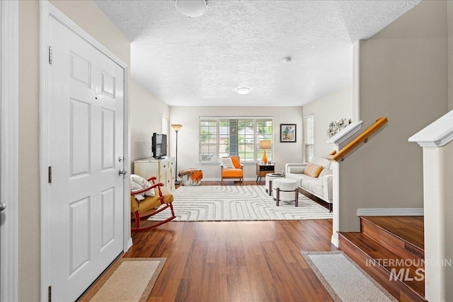 2972 N Saint James Pl, Boise, ID 83703 - foyer with wood finished floors, a textured ceiling, and stairs