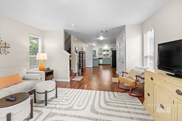 2972 N Saint James Pl, Boise, ID 83703 - living room featuring stairs, dark wood-style floors, plenty of natural light, and a textured ceiling
