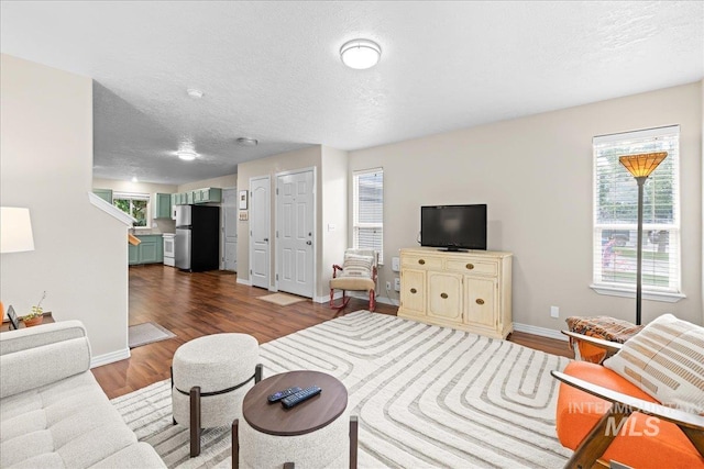 2972 N Saint James Pl, Boise, ID 83703 - living area with wood finished floors and a textured ceiling