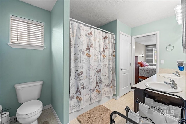 2972 N Saint James Pl, Boise, ID 83703 - ensuite bathroom with double vanity, a textured ceiling, and shower / bath combo