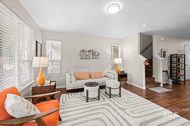 2972 N Saint James Pl, Boise, ID 83703 - living room featuring stairs, wood finished floors, and a textured ceiling